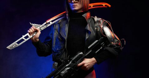 Female killer with sword and rifle in colourful and dark background