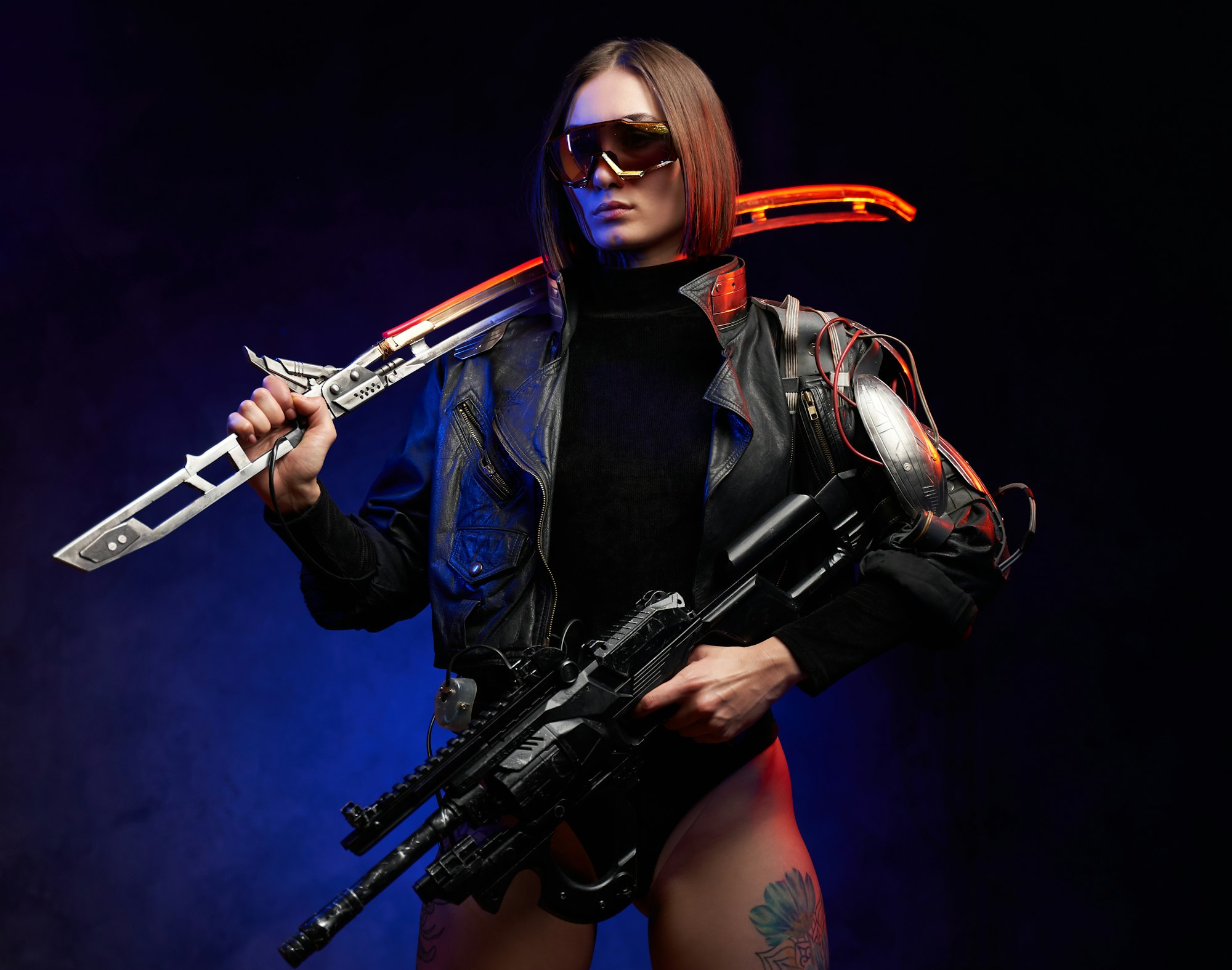 Female killer with sword and rifle in colourful and dark background